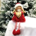 BOŽIĆNA DEKORACIJA VILA SJEDEĆA CRVENO-BIJELA SA ZLATNIM SRCEM 27 cm